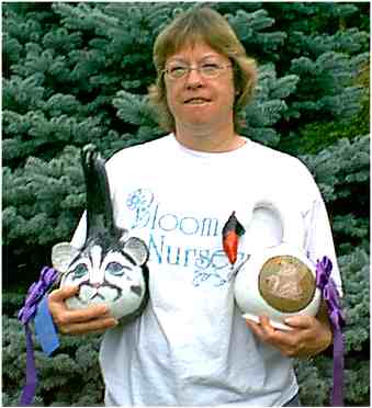 Martha Bloom with decorated gourds